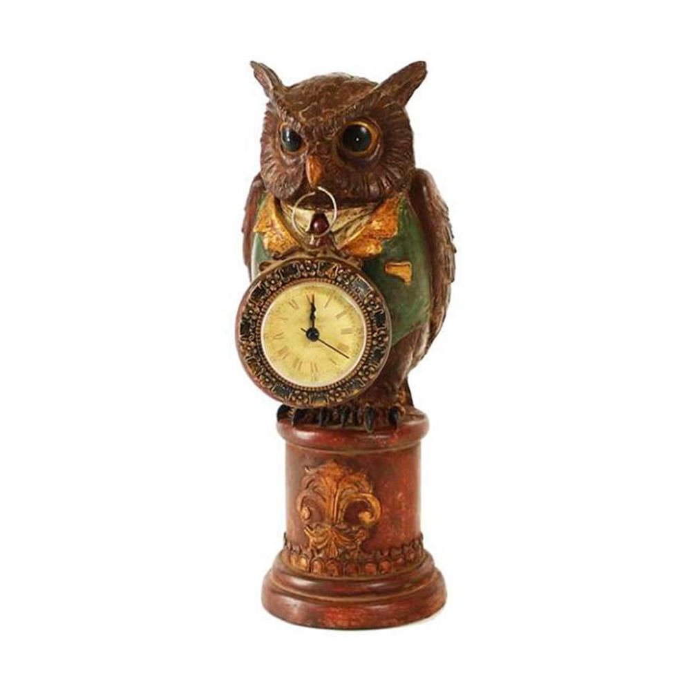 Fub Funky stílusú, 32 cm magas, díszes talapzaton gubbasztó, csőrében órát tartó bagoly figura