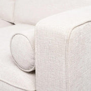 Bézs színű szövettel kárpitozott, 2 személyes kanapé.