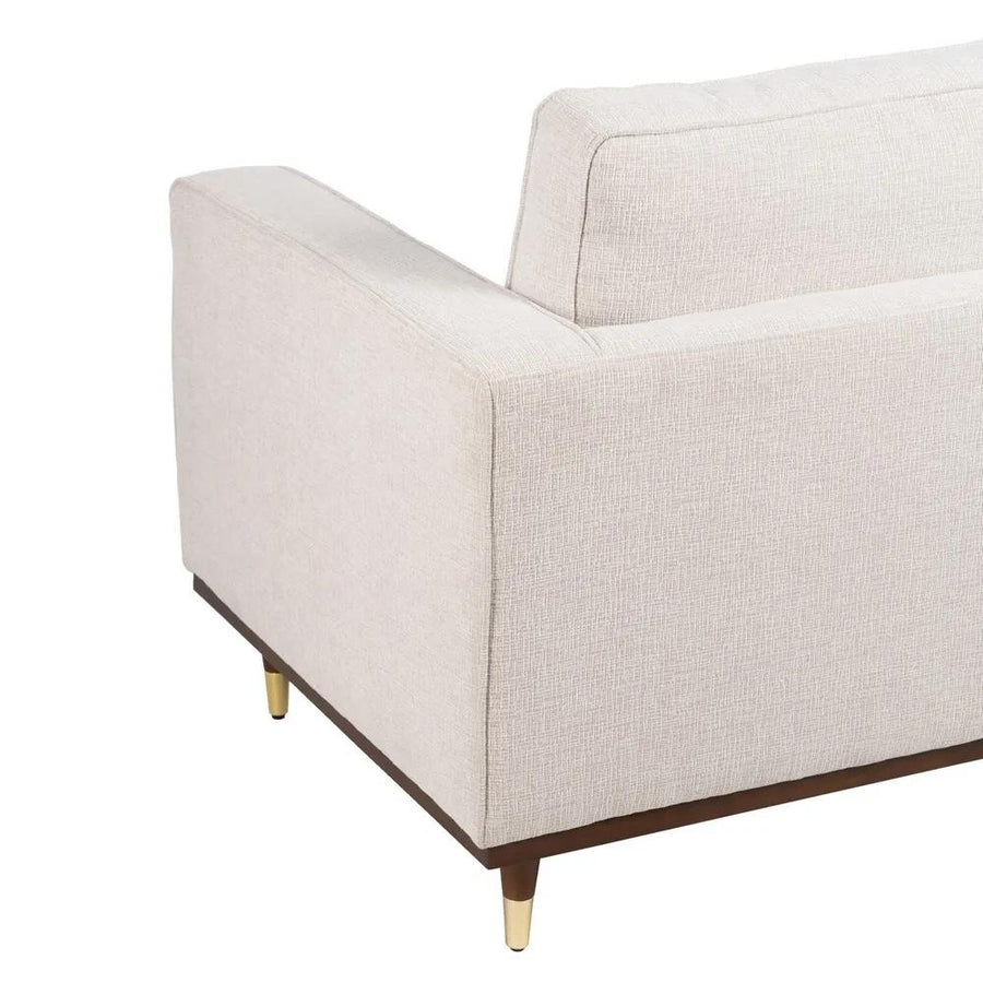 Bézs színű szövettel kárpitozott, 2 személyes kanapé.