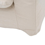 Bézs színű pamutvászon kárpitozású, kényelmes párnákkal ellátott kortárs kanapé..