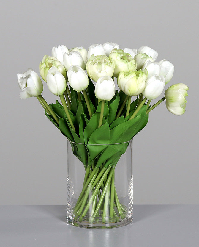 Mű tulipán csokor, henger formájú üvegvázában.