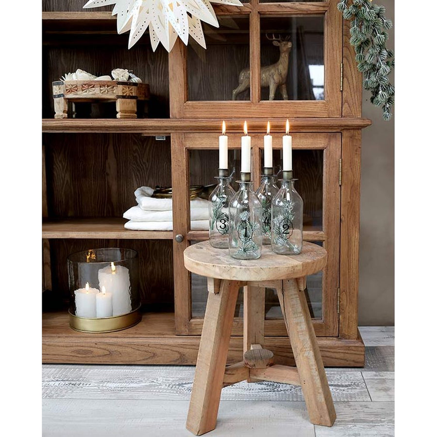 4 darabos, számozott díszítésű üvegpalackba kialakított adventi gyertyatartó szett.