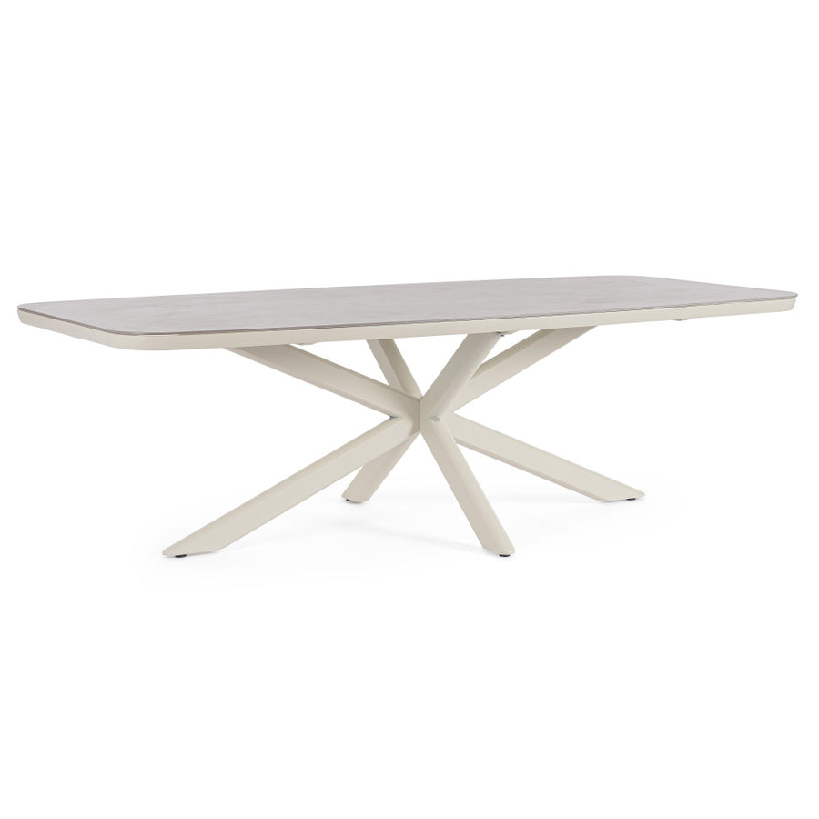 Kortárs, bézs színű, alumíniumvázzal rendelkező kültéri étkezőasztal szinterezett kő fedlappal.