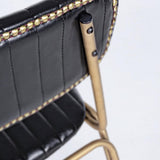 fekete műbőr bárszék részlet arany szegecsekkel