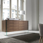 Kortárs, diófa furnérral borított, dizájn komódszekrény edzett üveg lábakkal.