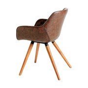 Barna műbőrrel kárpitozott, kőrisfából készült, formatervezett dizájn étkezőszék.