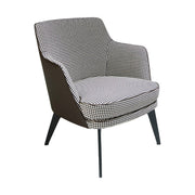 Kortárs stílusú, fekete színű műbőrrel és pepita színű szövettel kárpitozott dizájn fotel.