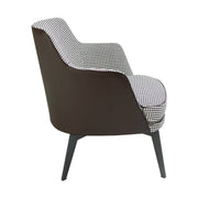 Kortárs stílusú, fekete színű műbőrrel és pepita színű szövettel kárpitozott dizájn fotel.