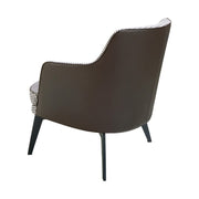 Kortárs stílusú, fekete színű műbőrrel és pepita színű szövettel kárpitozott dizájn fotel.