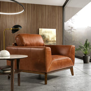 Kortárs stílusú, dohánybarna bőrrel kárpitozott, dizájn fotel diófa lábakkal.