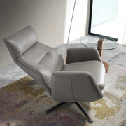 Kortárs stílusú, dönthető, forgatható, szürke színű bőrrel kárpitozott pihenőfotel.