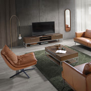 Kortárs stílusú,barna bőrrel kárpitozott, forgatható, dizájn pihenőfotel fekete színű acéllábakkal.