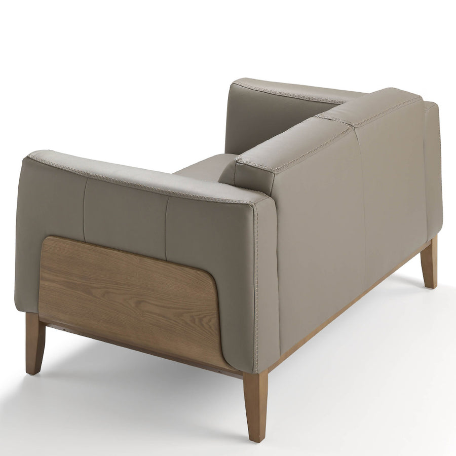 Kortárs, taupe színű bőrrel kárpitozott, diófa furnérral borított, dizájn kanapé.