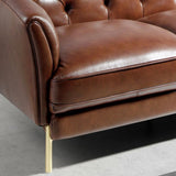 Angel Cerdá konyakbarna bőr kanapé ülőfelület és arany láb részlet