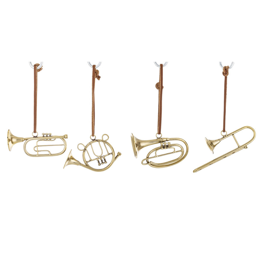 Arany minihangszerek alsó nézetben – fényes fém felület és bőrszíjak.