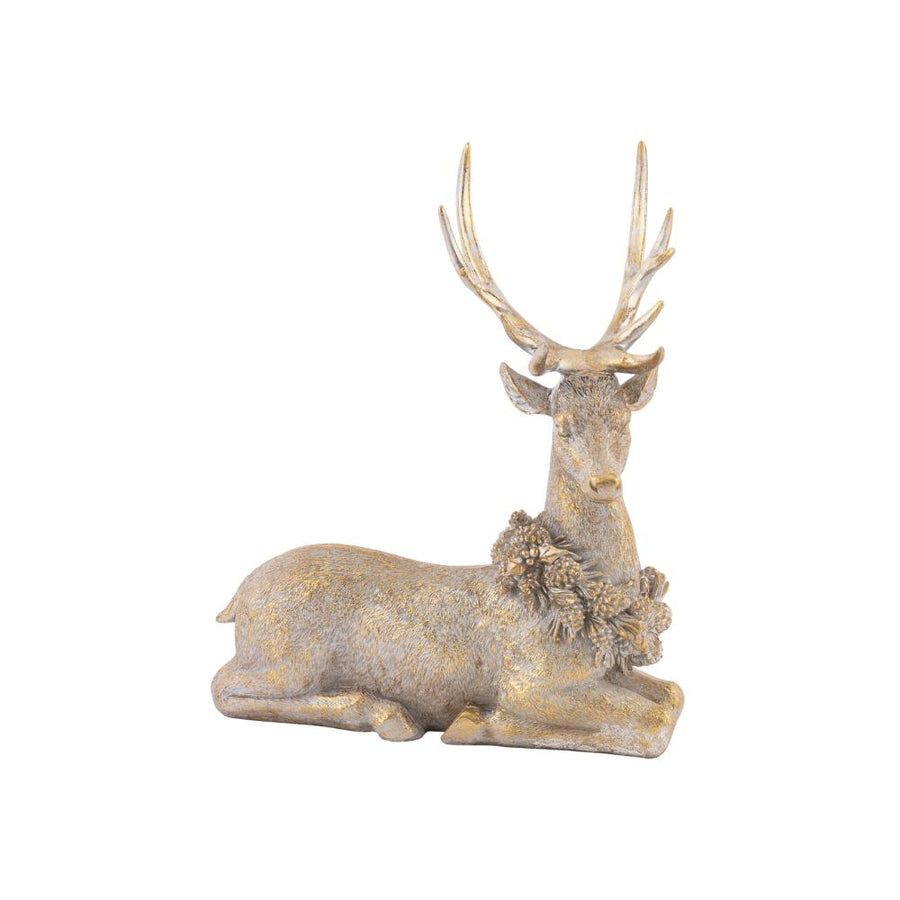 Vintage arany szarvas dekoráció fekvő pozícióban, részletgazdag antikolt felülettel, enyhén oldalnézetből
