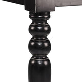 Esztergált fekete asztalláb – koloniál stílusú díszítéssel, közelről