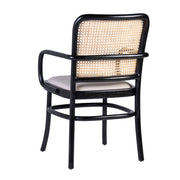 Koloniál stílusú, fekete színű, teakfa étkezőszék rattan háttámlával és bézs ülőfelülettel.