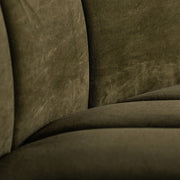 A kortárs stílusú, olajzöl bársonnyal kárpizotott moduláris kanapé háttámla részlete.