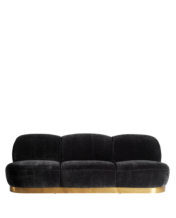 Modern art deco stílusú, fekete színű bársonnyal kárpitozott kanapé.
