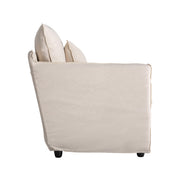 Bézs vászon fotel oldalsó nézetből – puha, ölelő forma
