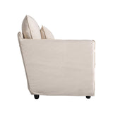 Bézs vászon fotel oldalsó nézetből – puha, ölelő forma
