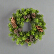 Zöld színű, mű jegenyefenyő koszorú.