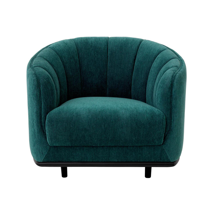 Tengerzöld színű szövettel kárpitozott dizájn fotel.