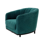 Tengerzöld színű szövettel kárpitozott dizájn fotel.