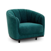 Tengerzöld színű szövettel kárpitozott dizájn fotel.