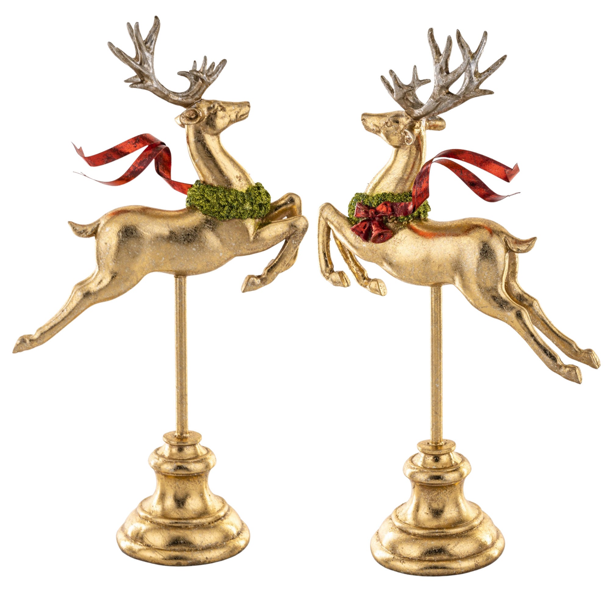 Piros színű fémmasnival díszített, fényes felületű, arany színű karácsonyi szarvas figura.