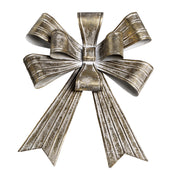 Rézszínű, fémből készült karácsonyi dekor masni.