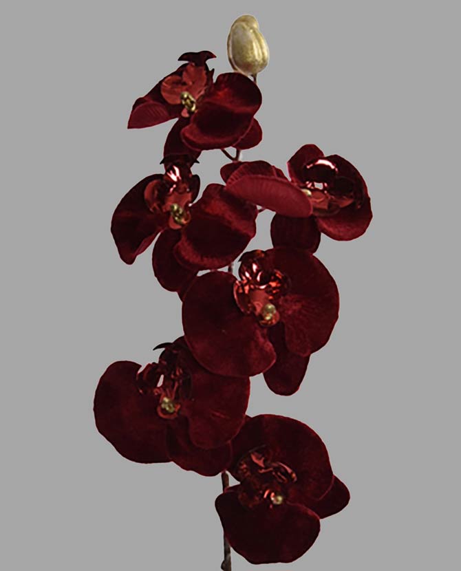 Burgundi színű, bársonyból készült szálas orchidea művirág.