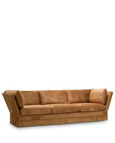Rézszínű bársonyszövettel kárpitozott, modern stílusú exkluzív kanapé.