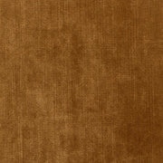 Rézszínű bársonyszövettel kárpitozott, modern stílusú exkluzív kanapé.