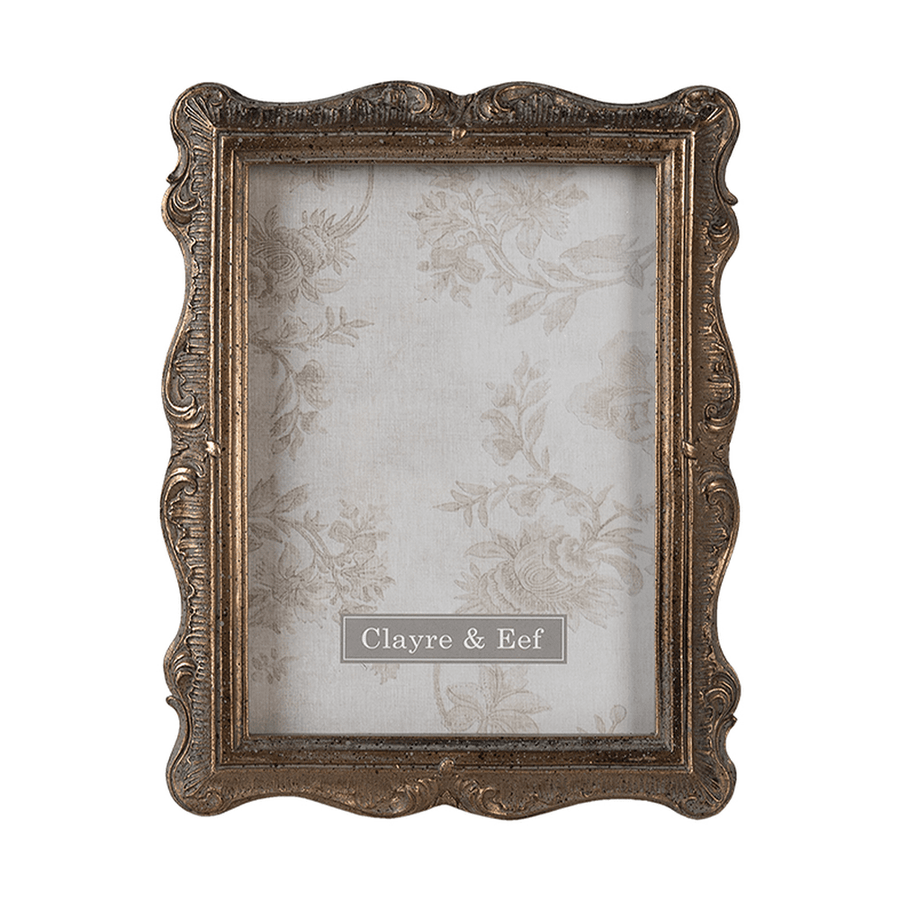 Aranyszínű asztali fényképtartó.