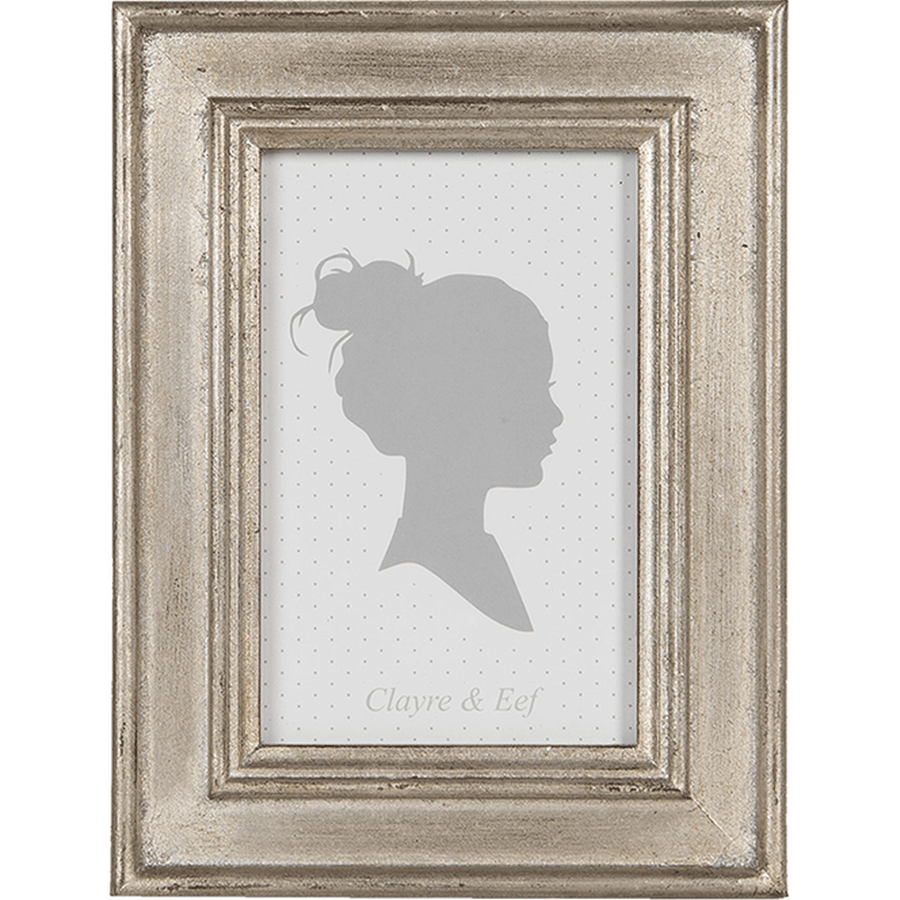 Antikolt felületű, ezüstszínű asztali fényképtartó.