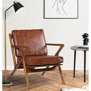 Teakfából készült, antikolt dohánybarna színű bőrrel kárpitozott, kézműves design fotel.