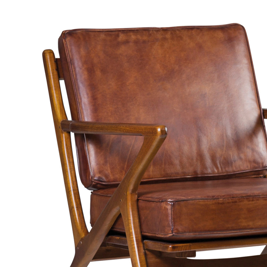 Teakfából készült, antikolt dohánybarna színű bőrrel kárpitozott, kézműves design fotel.