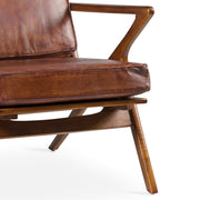Teakfából készült, antikolt dohánybarna színű bőrrel kárpitozott, kézműves design fotel.
