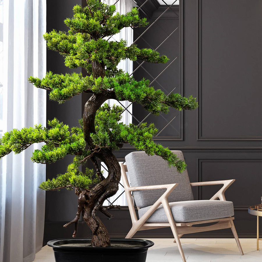 Zöld színű, mű mirtusz bonsai fa, fekete ovális műanyagkaspóban.