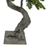 Zöld színű, mű fenyő bonsai fa.