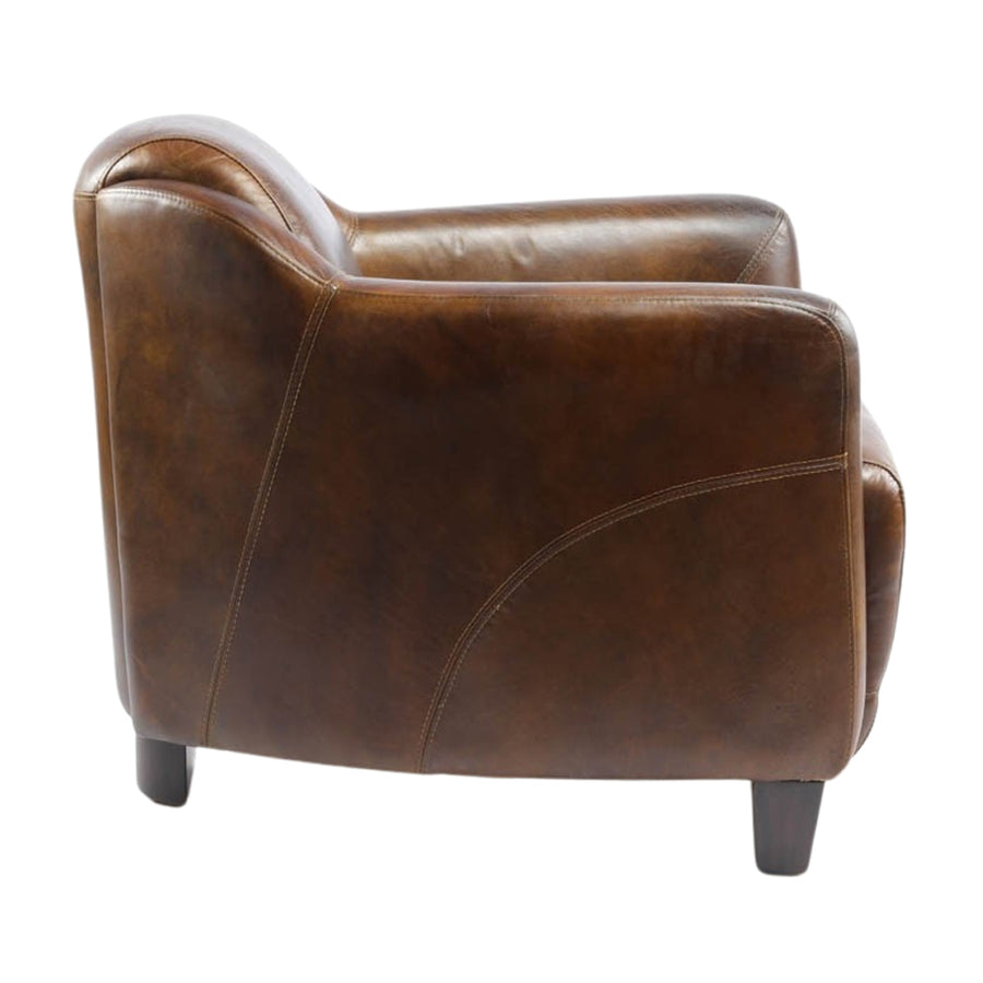 Dohánybarna színű bőrrel kárpitozott bőrfotel.