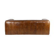 Hátsó nézet a Boston kanapéról, vertikális varrásokkal és telt formákkal