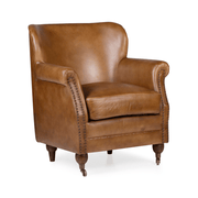 Konyakszínű marhabőrrel kárpitozott, szárnyas bőrfotel.