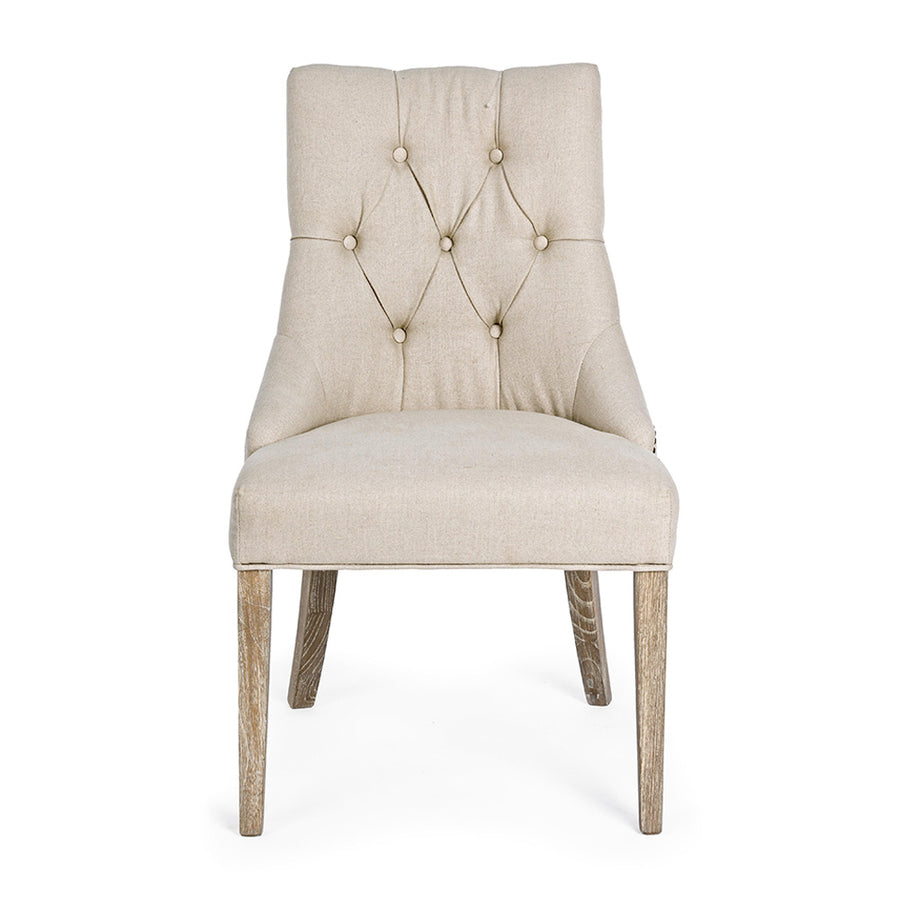 Bézs színű vászonnal kárpitozott, klasszikus formavilágú, elegáns étkezőszék.