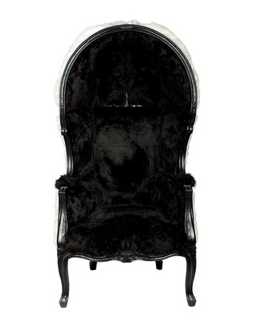 Fekete és fehér színű műszőrmével kárpitozott, kortárs stílusú design hintófotel.
