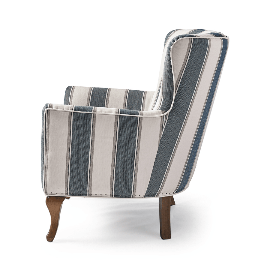 Kék és fehér csíkos szövettel kárpitozott, kézműves füles fotel.