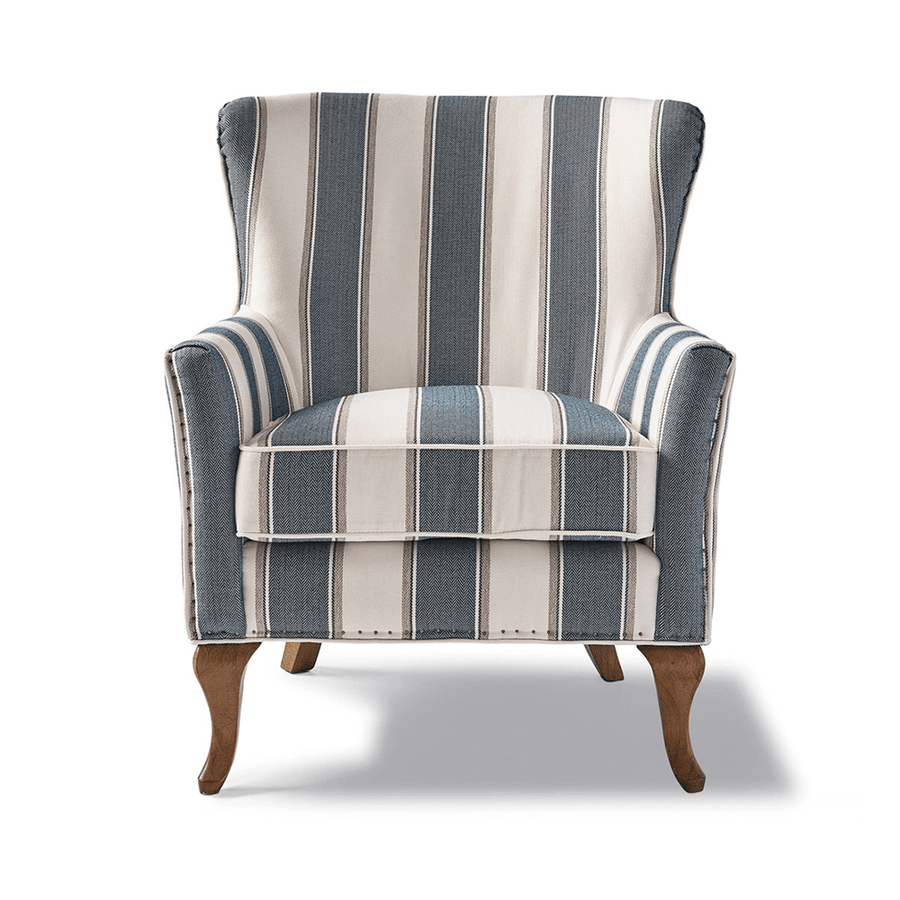 Kék és fehér csíkos szövettel kárpitozott, kézműves füles fotel.