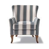 Kék és fehér csíkos szövettel kárpitozott, kézműves füles fotel.